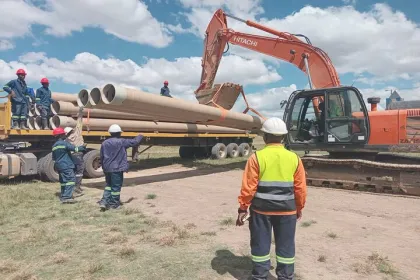 Pipes being offloaded from the truck